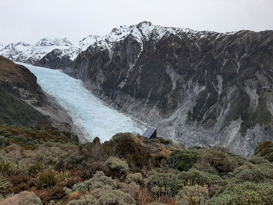 Close view of Fox Glacier with a GeoNet station in the foreground.