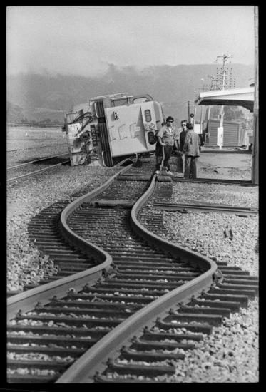 Railway lines and a locomotive affected by the Edgecumbe earthquake. [Ref #: EP/1987/0990/9 Part of The Dominion Post: Photographic negatives and prints of the Evening Post and Dominion newspapers (PAColl-7327) and (EP/1987/0990)]