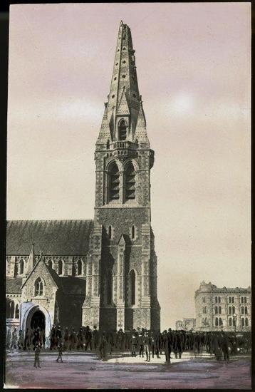 Photograph of crowd outside Christ Church Cathedral with earthquake damage to spire, Christchurch (after 1 September 1888). [Creator unknown. Ref #: PAColl-7985-72]