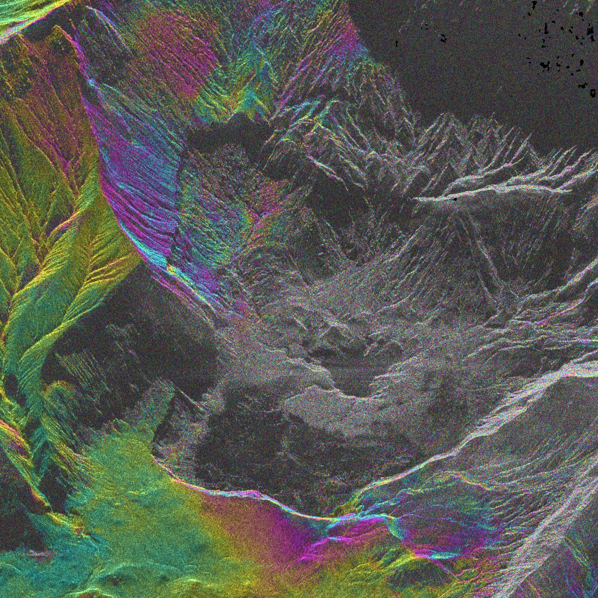 A computer constructed topography image of the active crater area at Whakaari/White Island. The topography is false coloured from the radar images and is overlain by coloured areas that represent deformation between two successive images.